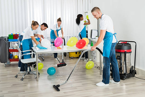 istock Janitors Cleaning The Office After Party 618529754