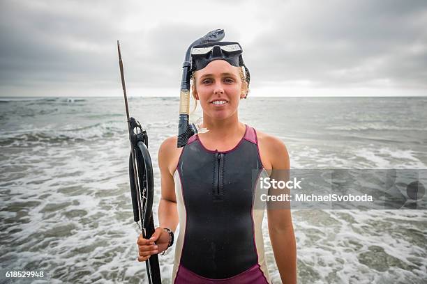 Spearfishing Women Standing In The Ocean Stock Photo - Download Image Now - Adult, Adults Only, Anticipation