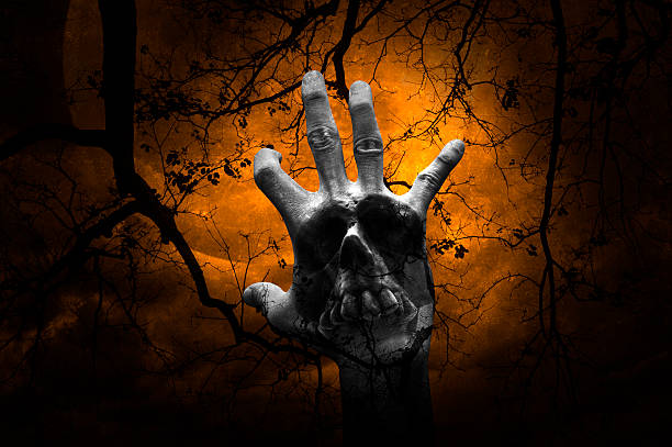 istock Hand blend with human skull over dead tree, Halloween concept 618531116