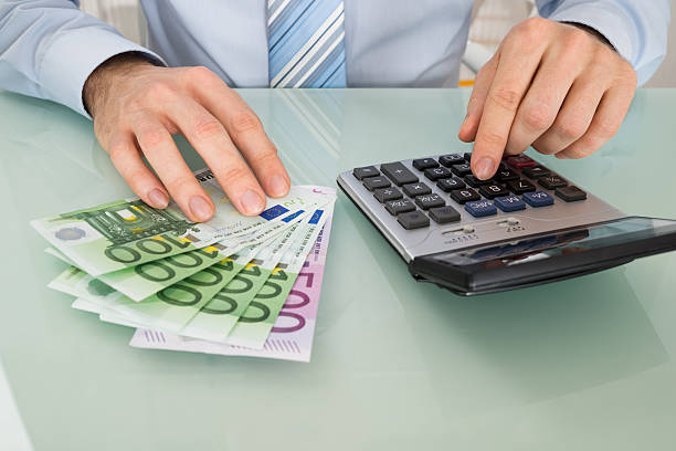 istock Businessperson With Banknote And Calculator 618531826