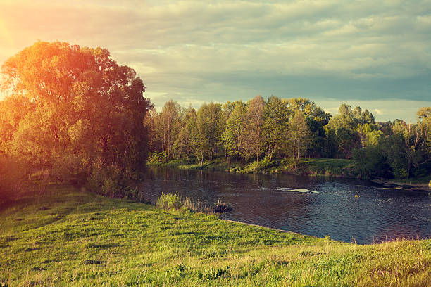 istock Rural landscape with lake at sunset 618533126