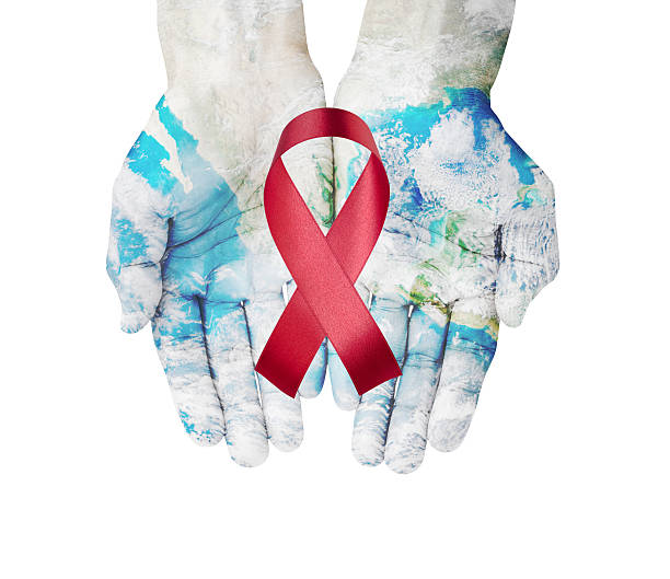 world map on hands with red ribbon on white background - world aids day stok fotoğraflar ve resimler