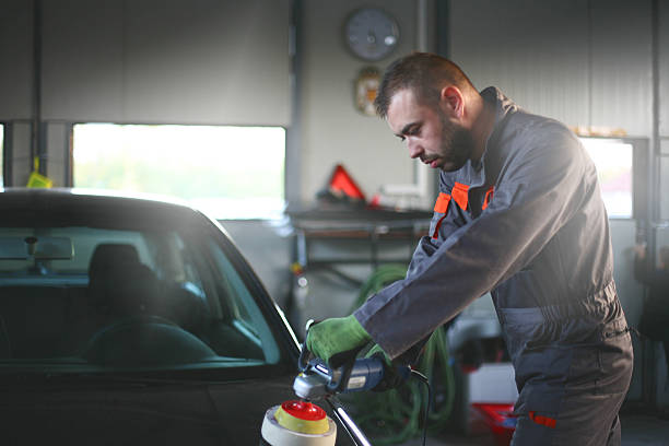 istock Mechanic changing glass on car. 618534598