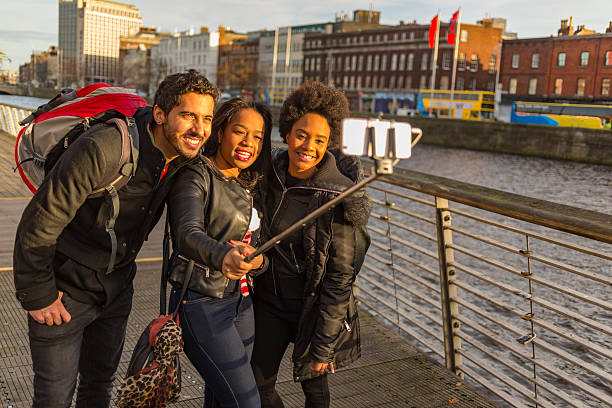 istock Tourists Taking Selfies on Vacation in Dublin Ireland 618534668