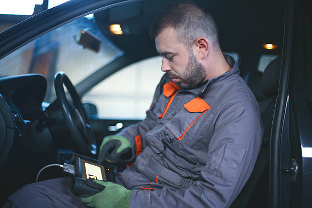 istock Young  mechanic repairing a car. 618534960