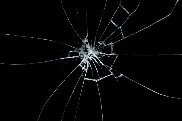 broken glass on black background - breekbaar stockfoto's en -beelden