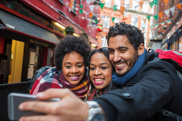 istock Tourists Taking Selfies on Vacation in Dublin Ireland 618535914