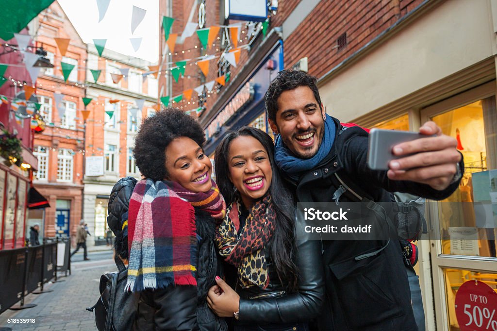 Tourists Taking Selfies on Vacation in Dublin Ireland Tourists taking selfies while on vacation in Dublin Ireland Dublin - Ireland Stock Photo