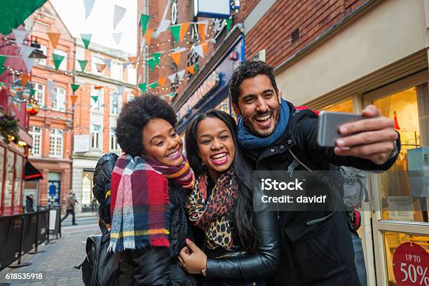 Tourists Taking Selfies On Vacation In Dublin Ireland Stock Photo - Download Image Now