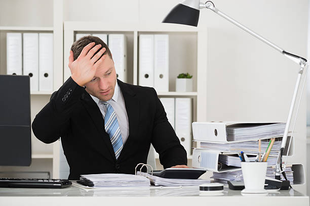 istock Tensed Accountant Sitting At Desk In Office 618536544