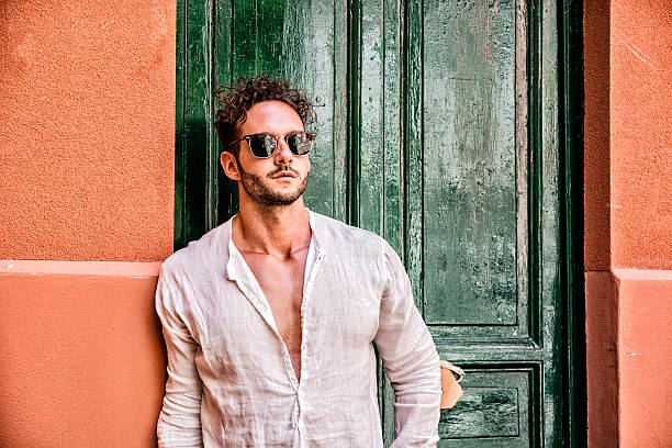 istock Handsome man leaning against door 618536658