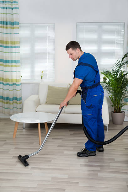 istock Worker Cleaning Floor With Vacuum Cleaner 618536834