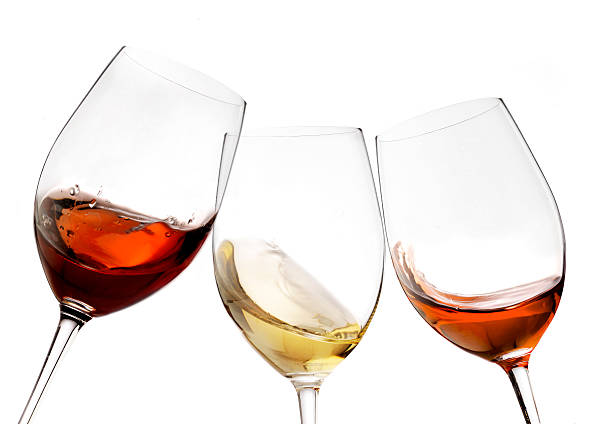 red and white wine with splash, cheers close up  isolated stock photo