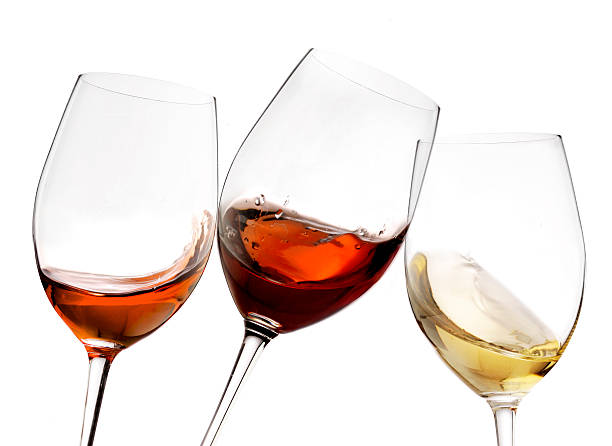 istock red and white wine with splash, cheers close up  isolated 618536930