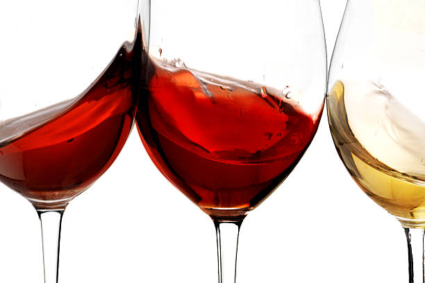 istock red and white wine with splash, cheers close up  isolated 618536962