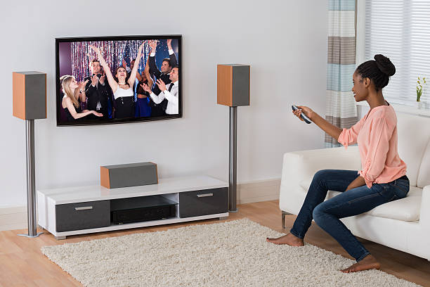 istock Young Woman Watching Movie 618538814