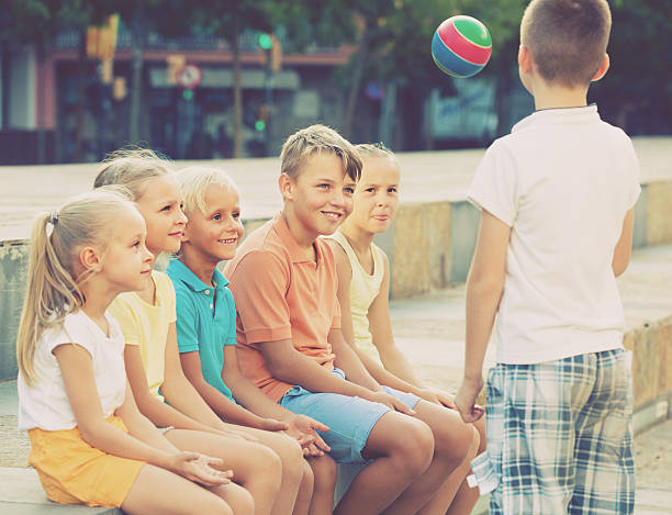 istock kids playing ball together 618539664