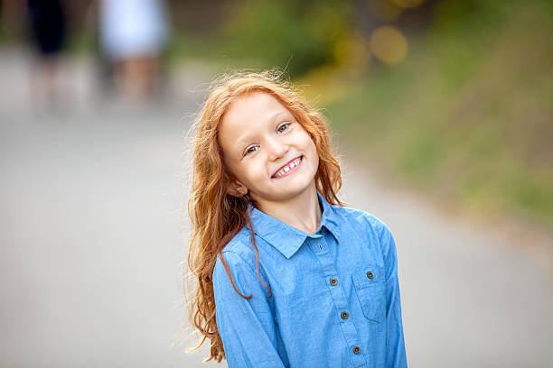 Little red-haired girl Close up portrait adorable little red-haired girl little redhead girl stock pictures, royalty-free photos & images