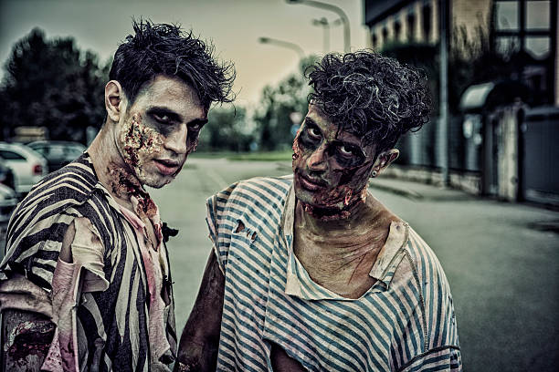 istock Two male zombies standing in empty city street 618540824