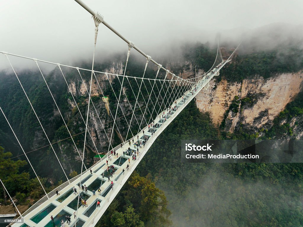 Glass bridge of Zhangjiajie China Worlds highest and longest glass Bridge as of 2016 in Zhangjiajie, CHunan, China Bridge - Built Structure Stock Photo