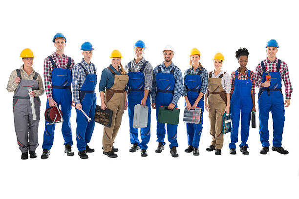 istock Portrait Of Confident Carpenters Carrying Toolboxes 618543304