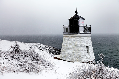 Castle Hill Lighthouse in Newport, Rhode Island during a blizzard. The lighthouse is the property of the U.S. government