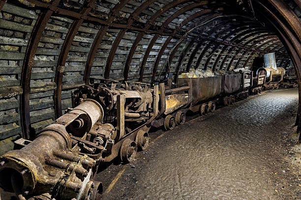 istock Coal mine underground corridor with railway carriages 618544898