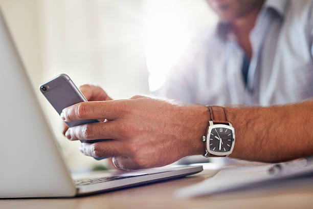 istock Business man hands busy using mobile phone 618544984