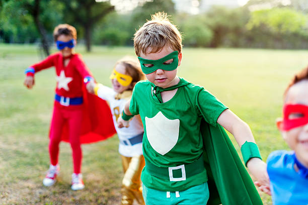 istock Superheroes Cheerful Kids Expressing Positivity Concept 618545296