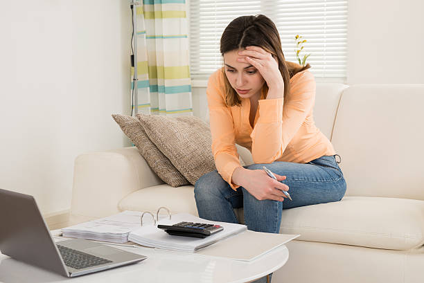 istock Sad Woman Sitting On Sofa 618546508