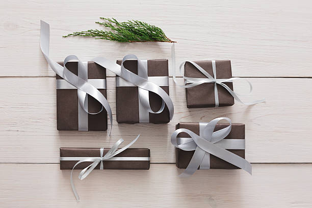 istock Top view of christmas present boxes on white wood background 618547292