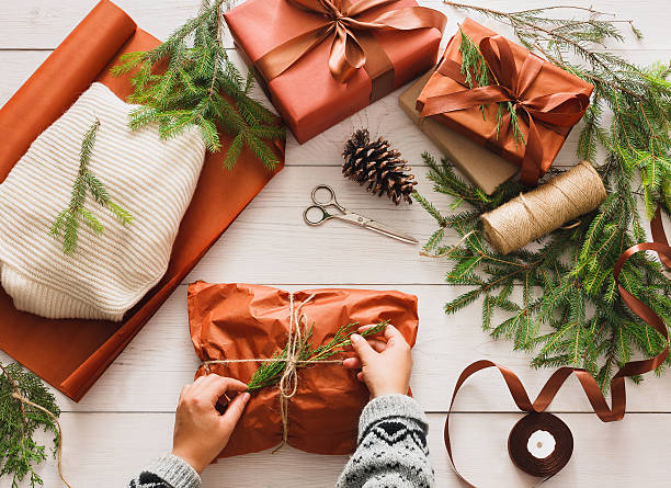 istock Wrapping christmas present gift on white wood background 618547648