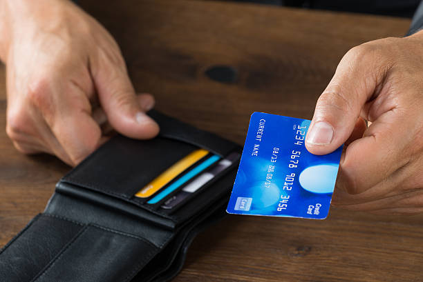 istock Businessman Giving Credit Card From Wallet 618547712
