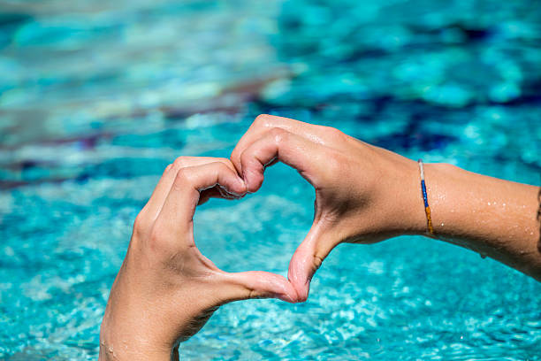 istock young man shows love sign 618547778