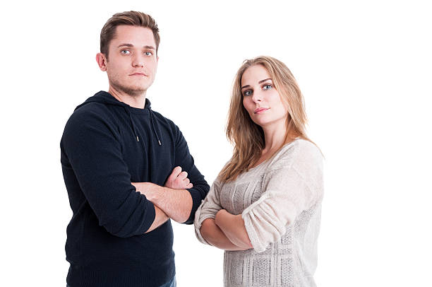 istock Couple posing and standing with arms crossed 618548630