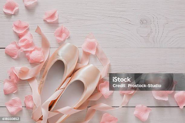 Pink Ballet Pointe Shoes On White Wood Background Stock Photo - Download Image Now - Practicing, Rose Petals, Satin