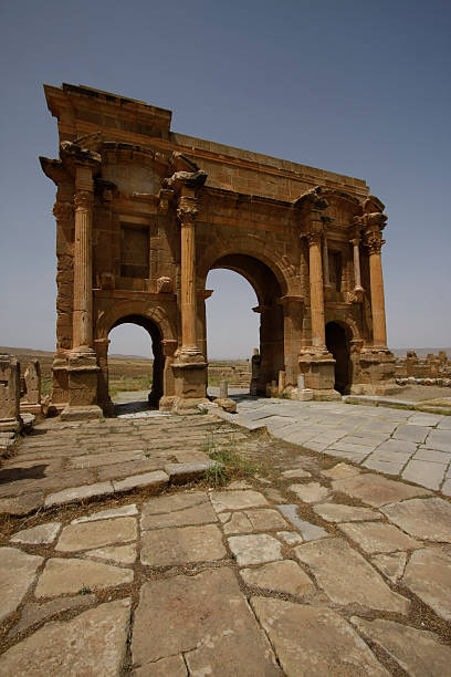 Arch of Trajan in Timgad, Algeria Timgad was a Roman-Berber town in the Aures Mountains of Algeria oran algeria photos stock pictures, royalty-free photos & images