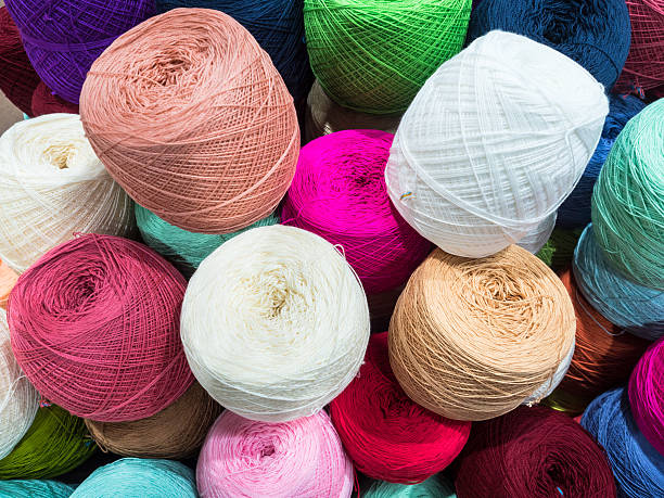 Multi color balls of wool and knitting stock photo