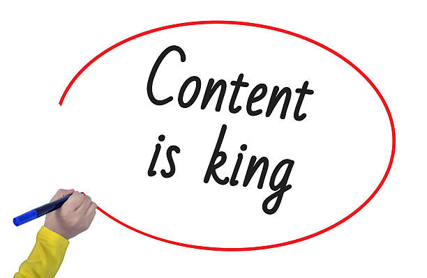 istock Woman hand writing content is king with marker 618552942