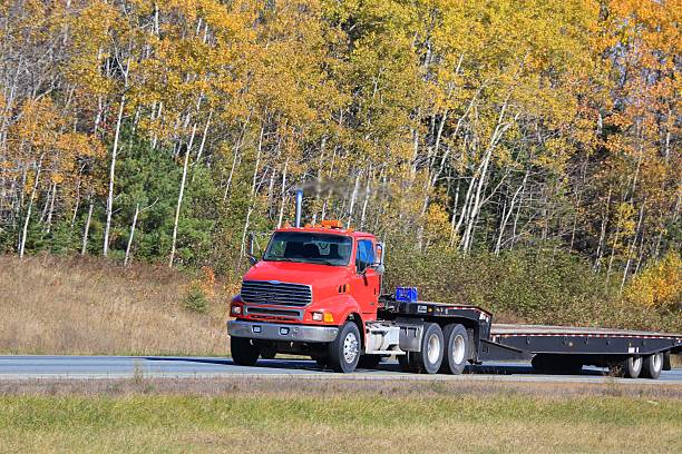 istock Semi-truck on a highway, trees in background. 618553056