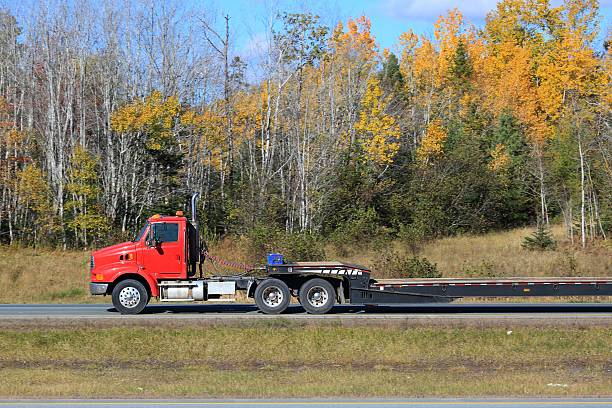 istock Semi-truck on a highway, trees in background. 618553188