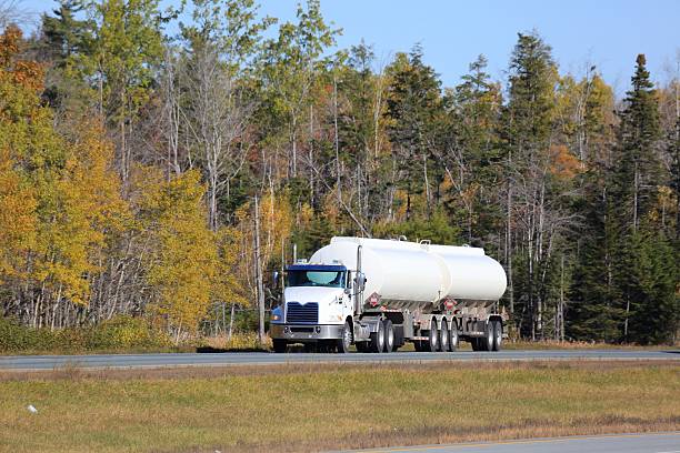istock Tanker  truck, trees in background. 618553650