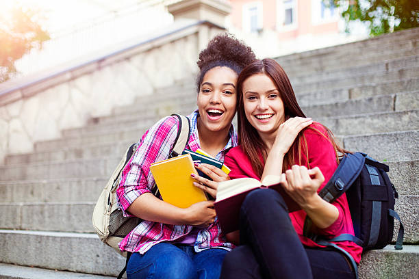 Students outdoor with books student, book, happy, stairs, outdoor back to school teens stock pictures, royalty-free photos & images