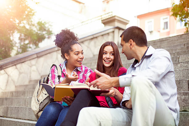 Students outdoor with books