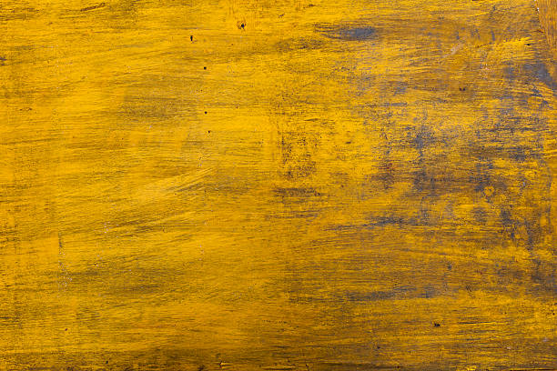 istock yellow painted wooden background 618553998