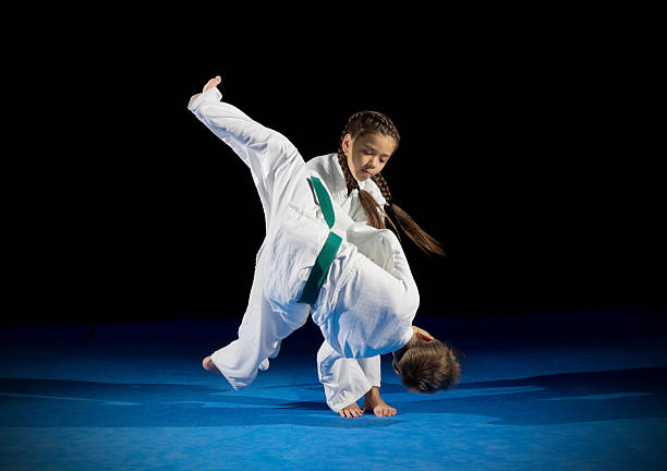 children martial arts fighters - karate judo belt aikido imagens e fotografias de stock