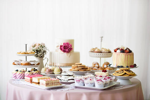 istock Table with loads of cakes, cupcakes, cookies and cakepops. 618556476
