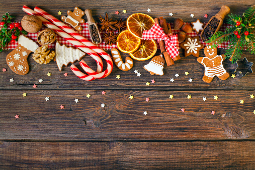 Christmas background with Christmas cookies, decoration and spices. Used gingerbread cookies home-handedly made it from me. They are unique pieces and can not be found anywhere.