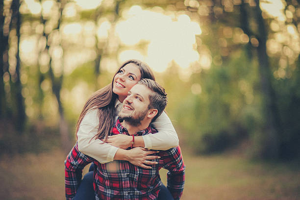 istock Cheerful couple having fun together during autumn day 618556784