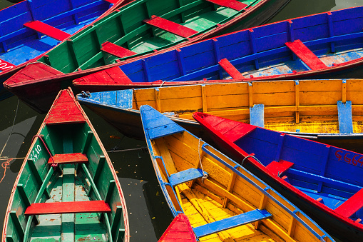 Pokhara. Nepal - April 11, 2016: colorful boats on the docks like background at Fewa lake in Pokhara,Nepal